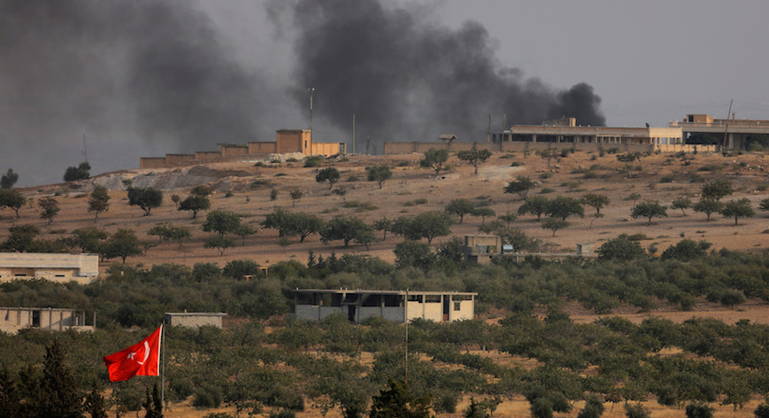 Smoke rises from the Syrian border town of Jarablus as it is pictured from the Turkish town of Karkamis, in the southeastern Gaziantep province